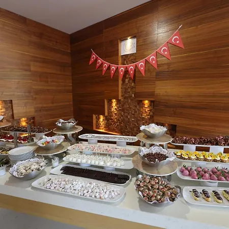 Отель Ramada Hotel & Suites By Wyndham Kusadasi